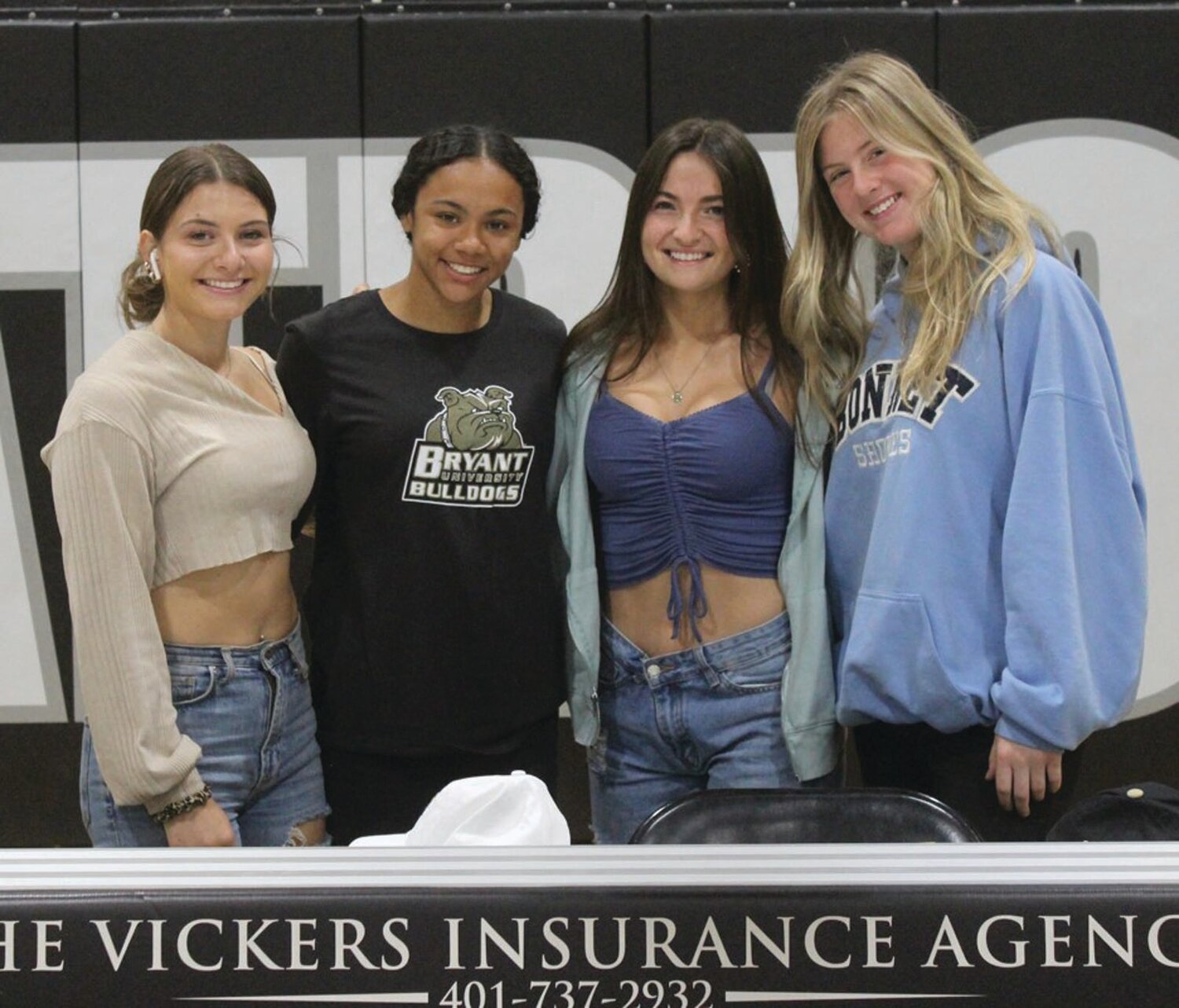 TEAMMATES: Dasani Stewart is joined by teammates at her signing ceremony.